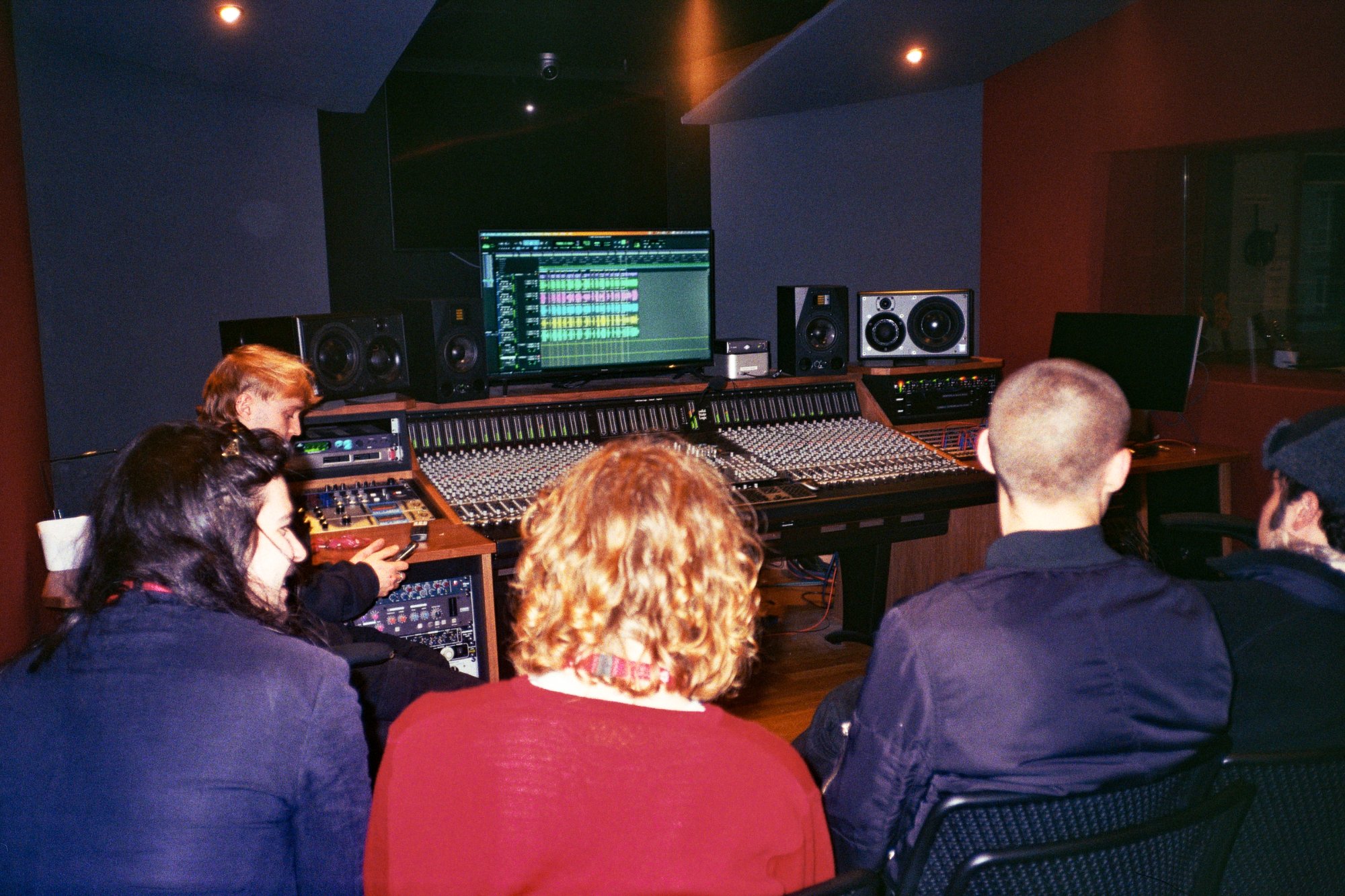 Townhouses listening back to recordings in the control room at the mixing desk